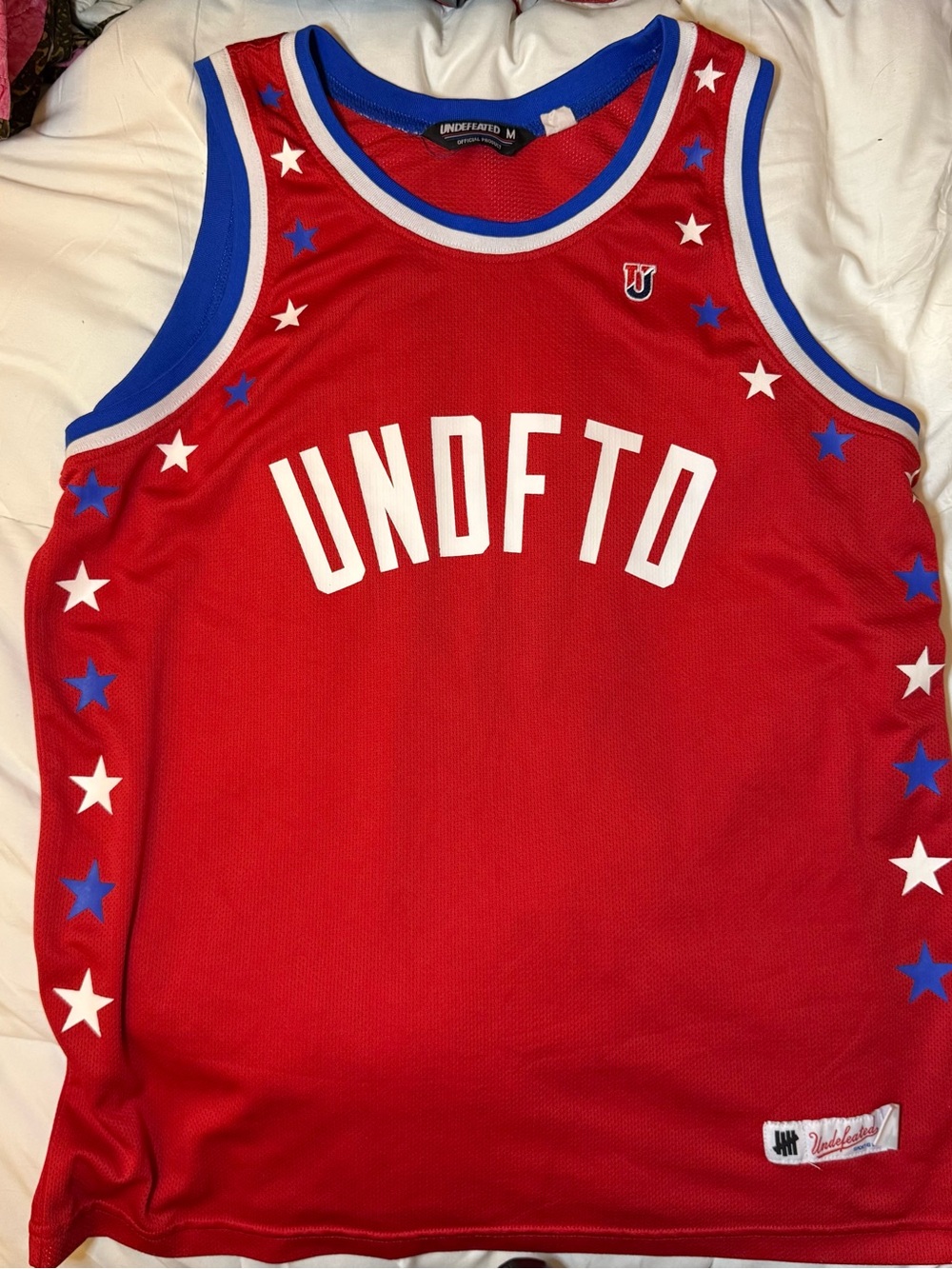 Undefeated Red Basketball Jersey with Blue & White Star Trim